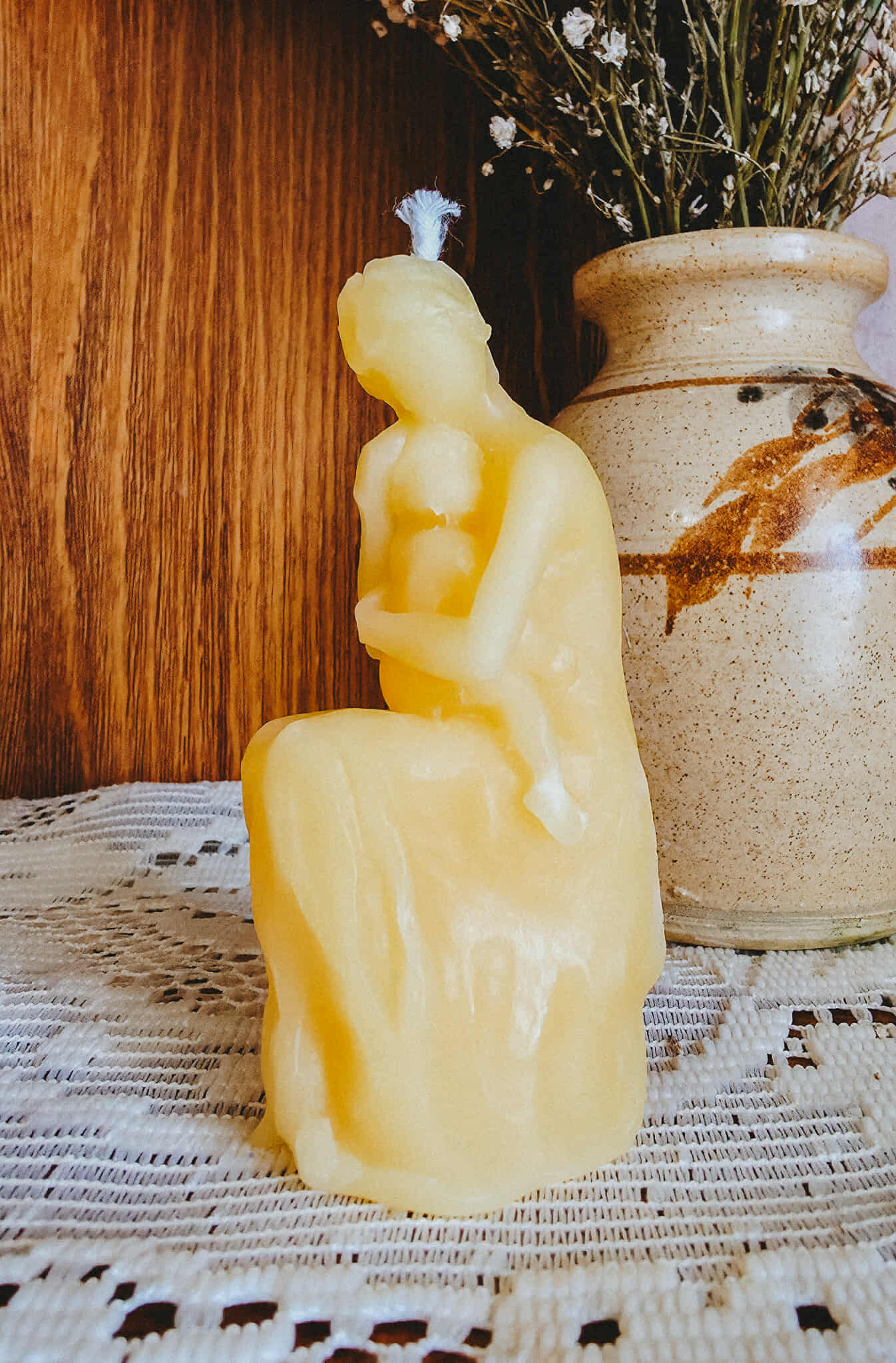 Mother holding Child on Lap Candle